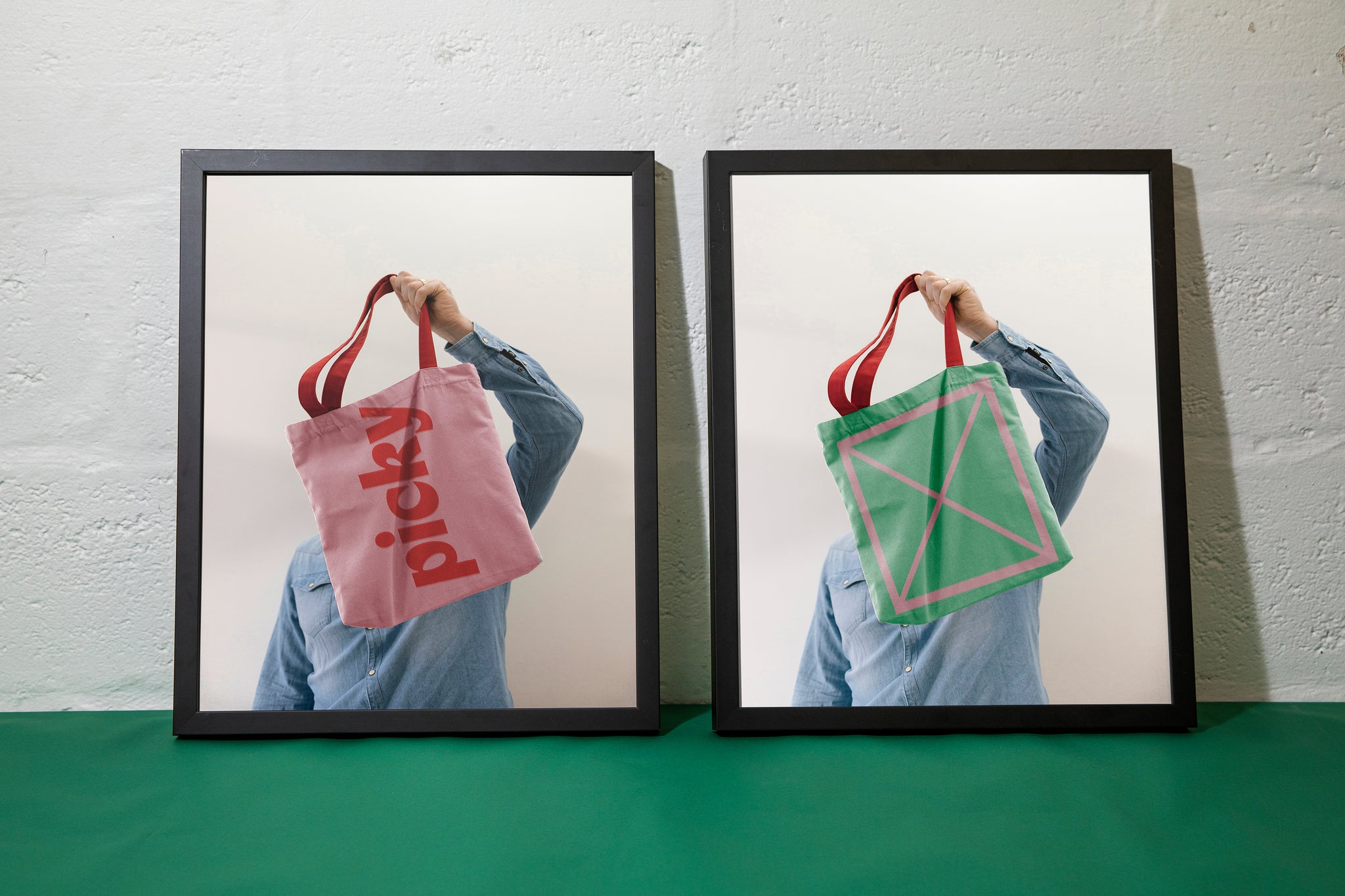 Landscape close-up of two black photo frames in front of a white backdrop. Framed is a person in a denim shirt holding pink and green picky branded tote bags.
