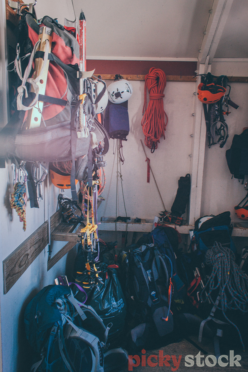 Alpine hut stashed with mountaineering and climbing gear