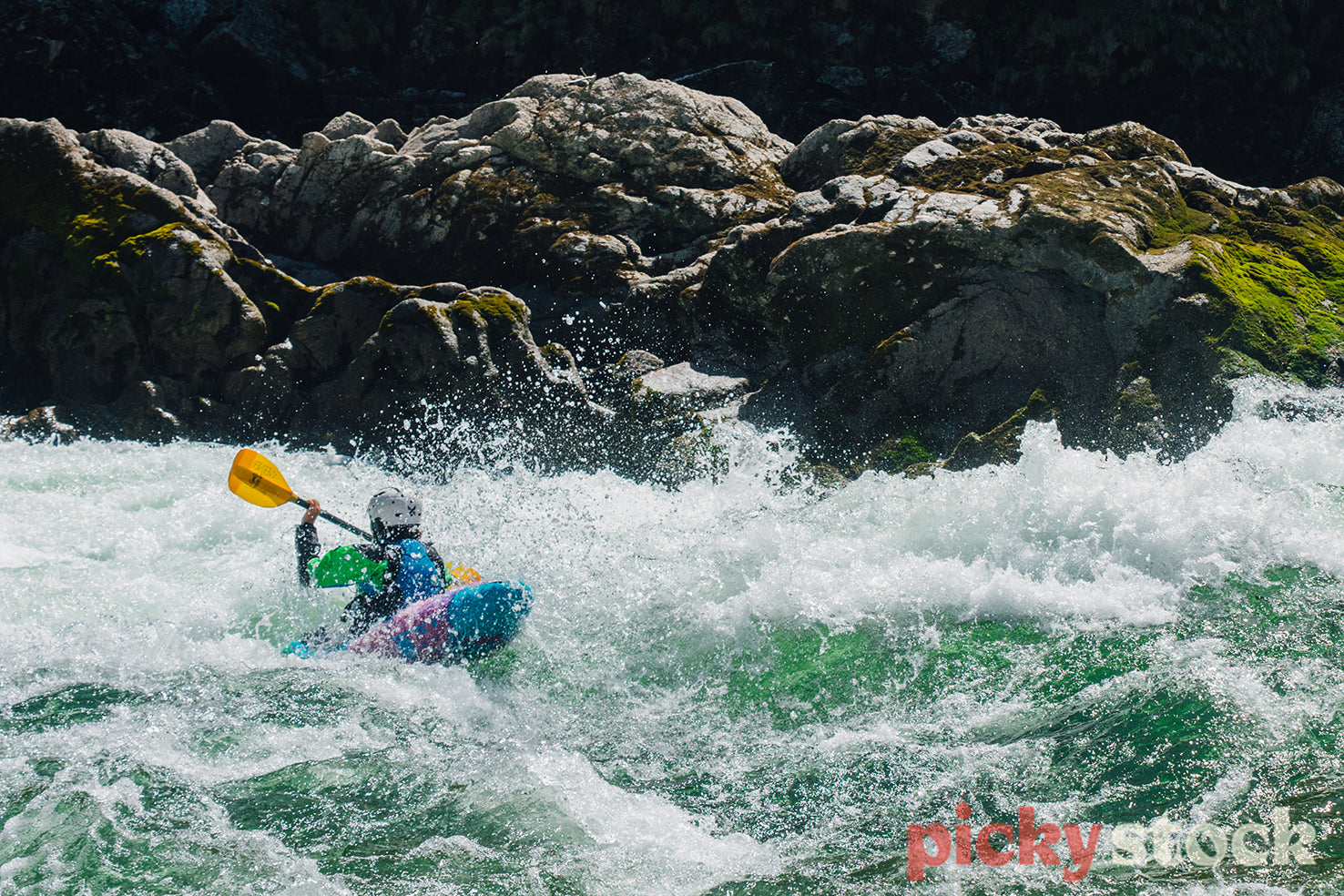 Whitewater kayaker in a rapid