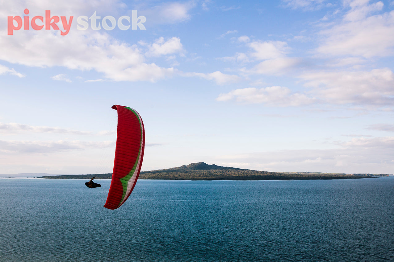 Paraglider over Auckland looking out to Rangitoto.