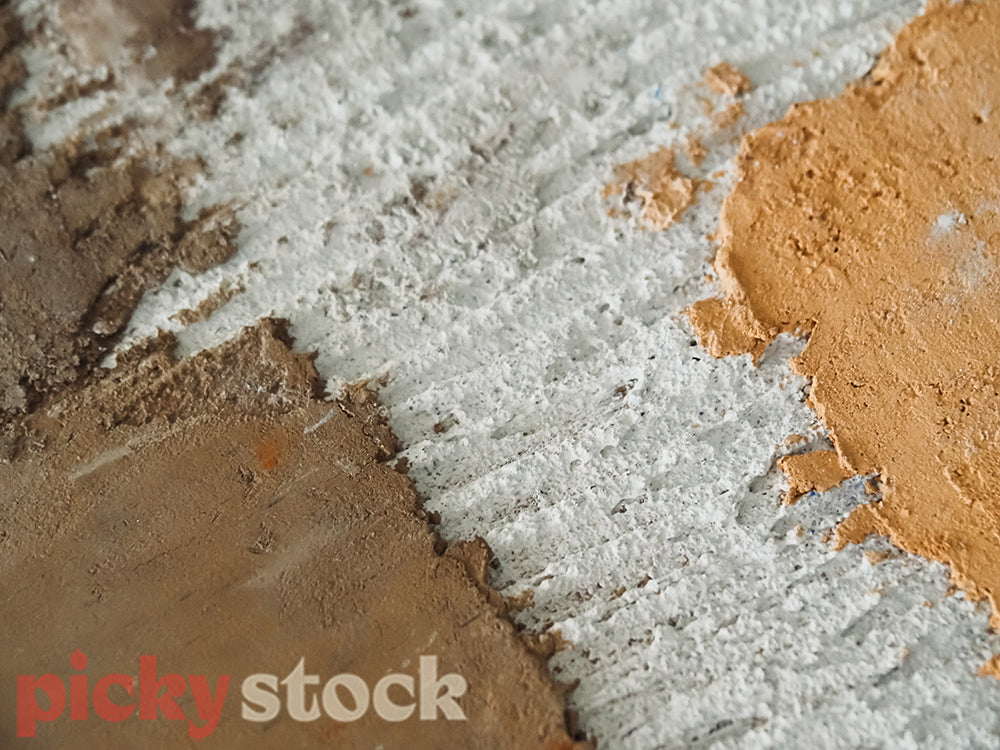 Close up of limestone plastering colour palette applied on screed. Taken on a construction site.