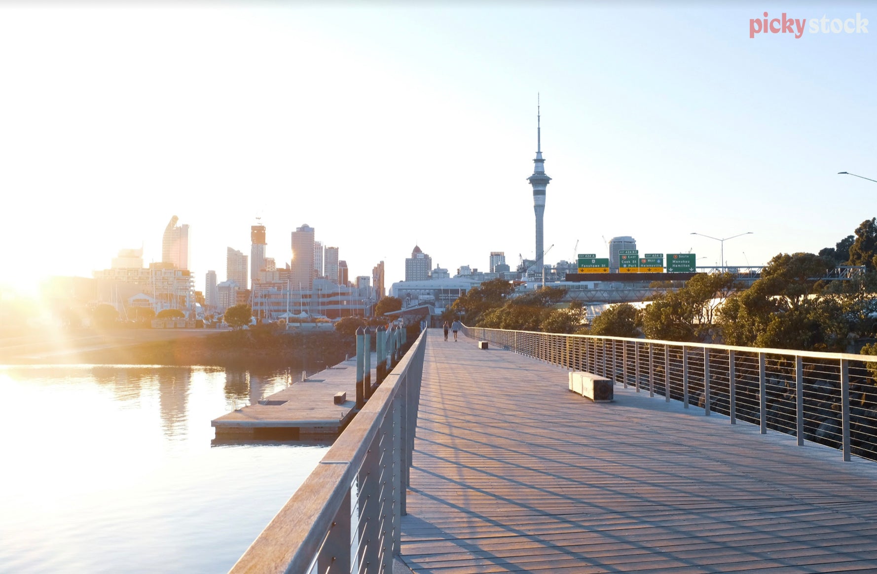 Looking along the Westhaven Boardwalk towards Auckland City on a calm evening.