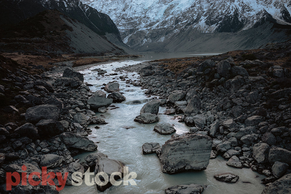 Sunset at Mount Cook National Park across river and rocks