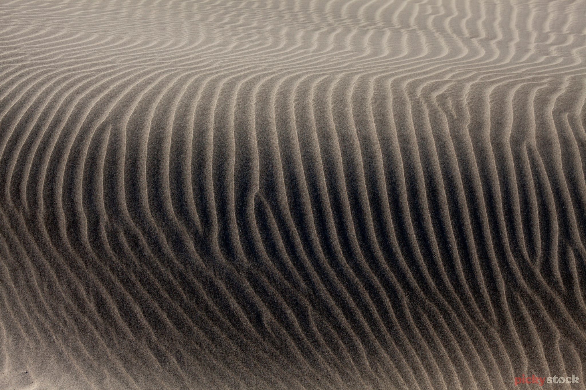 Close up angle shot of a sand dune and epic natural patterns.