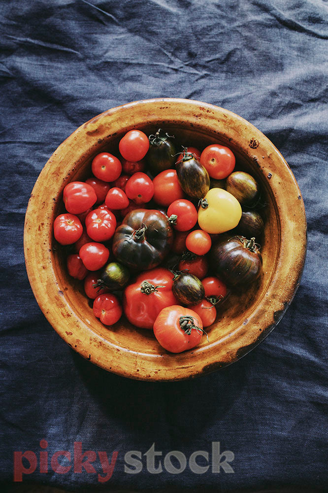 Platter of assortment of tomatoes in different varieties, colours & size