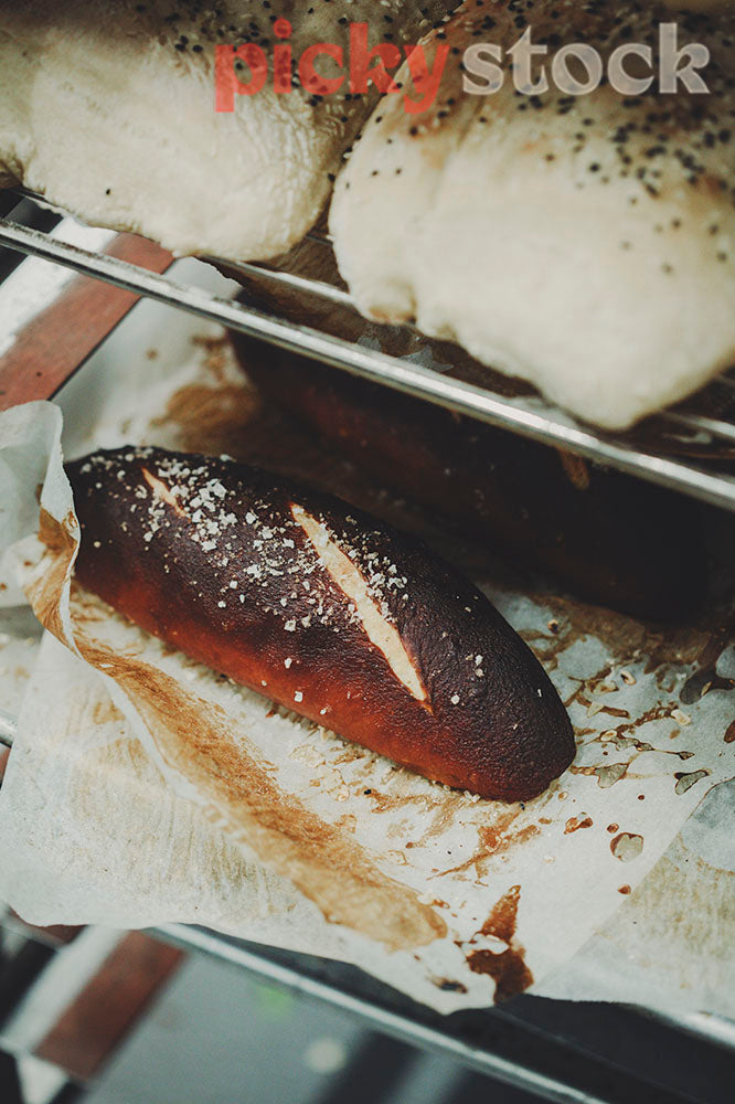 Baked bread roll in restaurant kitchen shelves