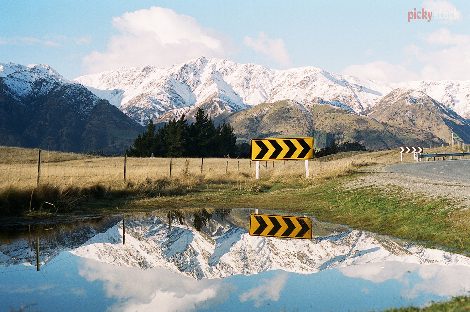 Wanaka reflections roadside with bright yellow road sign.