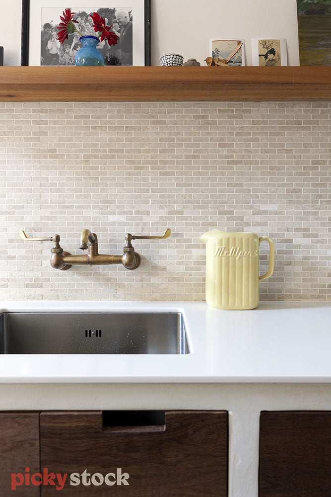 Kitchen with vintage taps and yellow jug