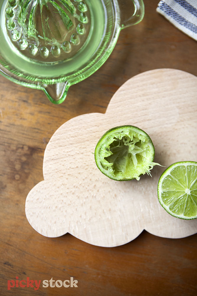 Flatlay of limes and chopping board