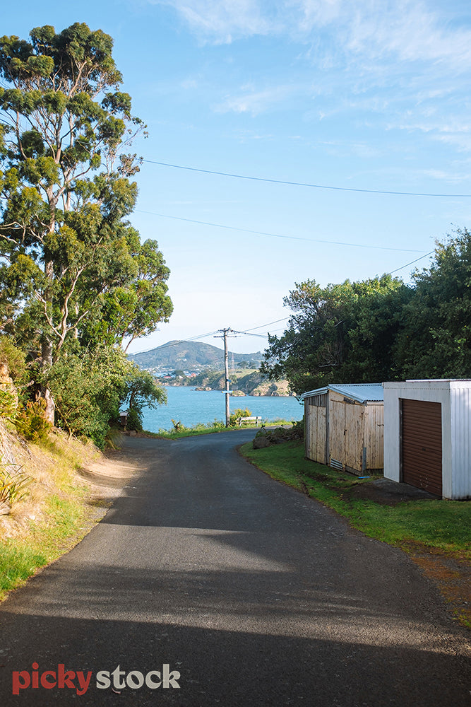 Looking down a small road out to beautiful bay