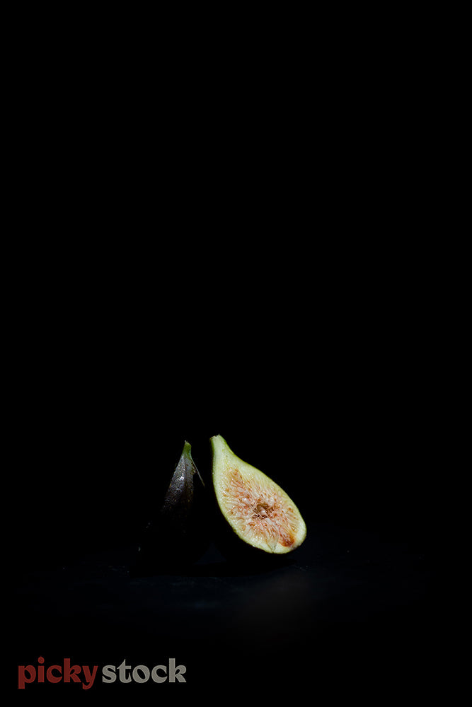 Cut fig against black low light