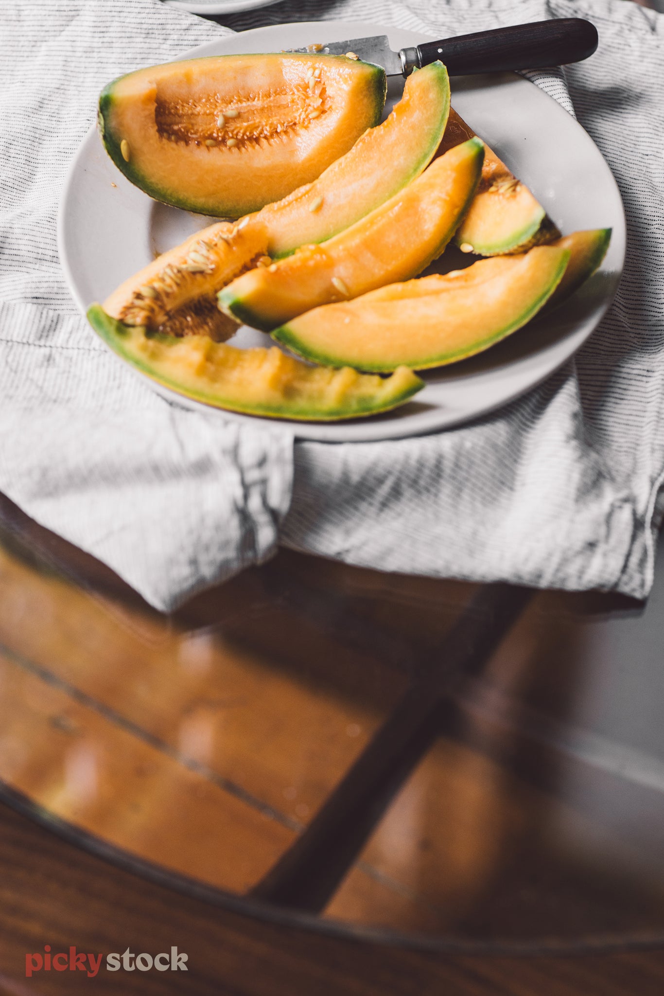 Fresh cut melon on a plate, in an Auckland home. 