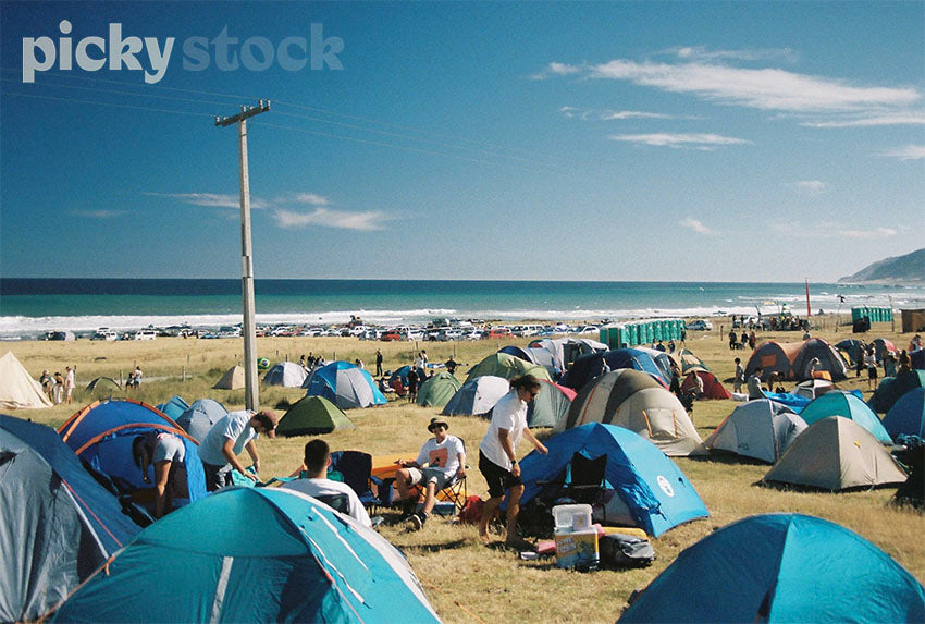 Tents set-up at summer festival near beach.