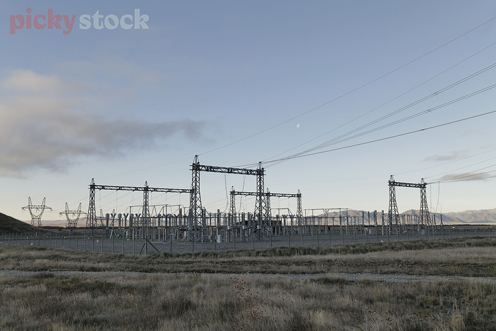 Power pylons in Twizel, on a chilly blue morning.  
