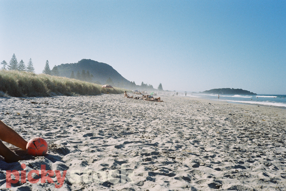 View from the beach looking toward Mt Maunganui, volleyball in foreground